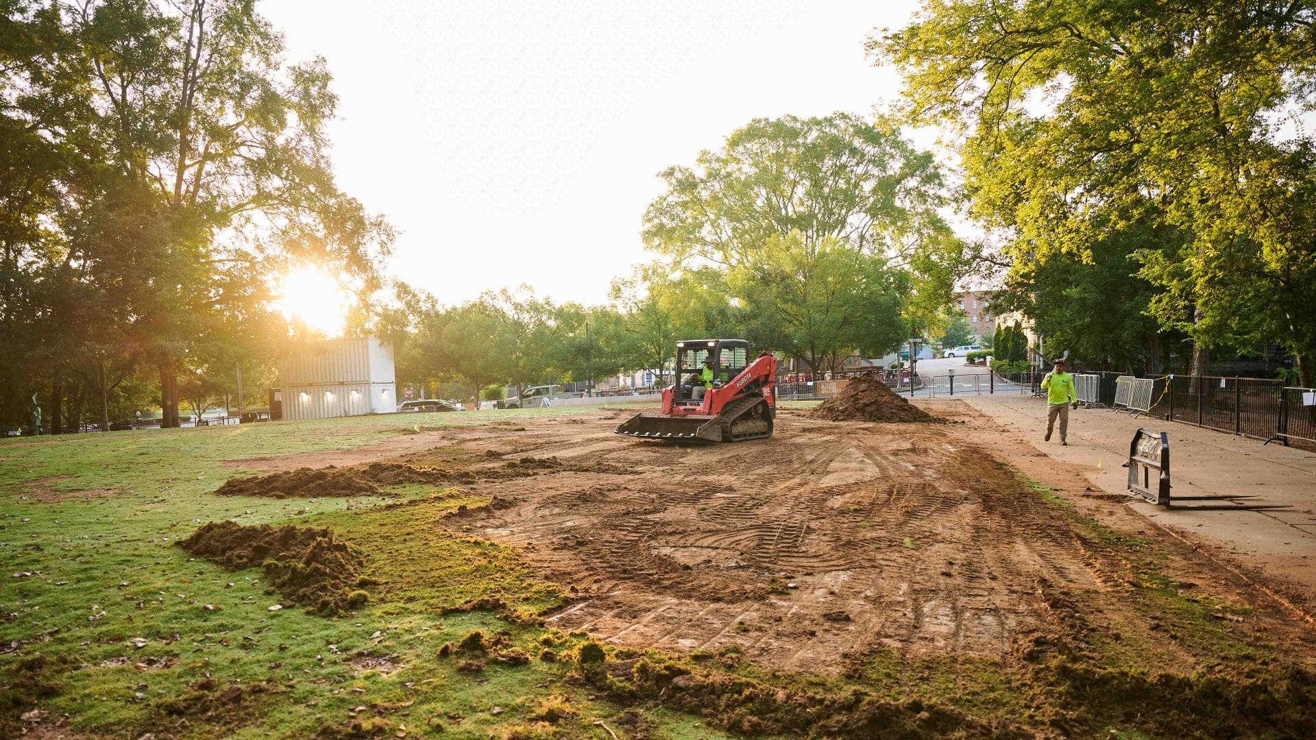 Small grader preparing ground for lawn